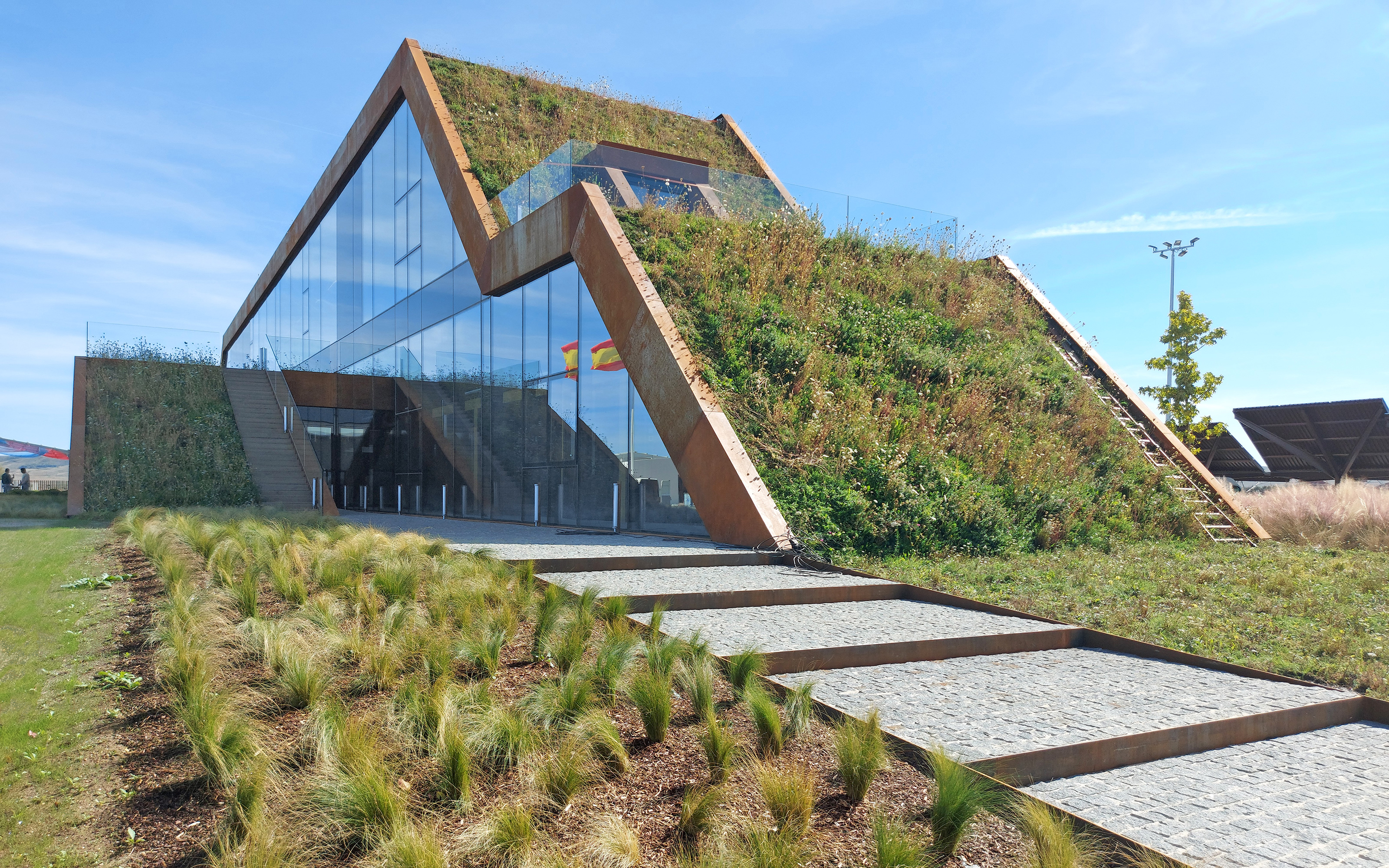 Shortly after planting the vegetation blends beautifully into the surroundings. Pitched green roof